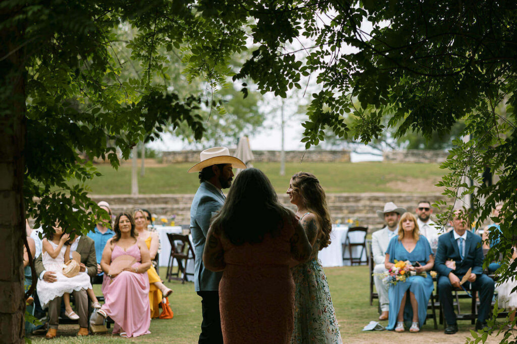 Moody photo of wedding ceremony in amphitheater